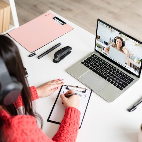 young-latin-woman-in-black-headphones-teaching-english-online.jpg